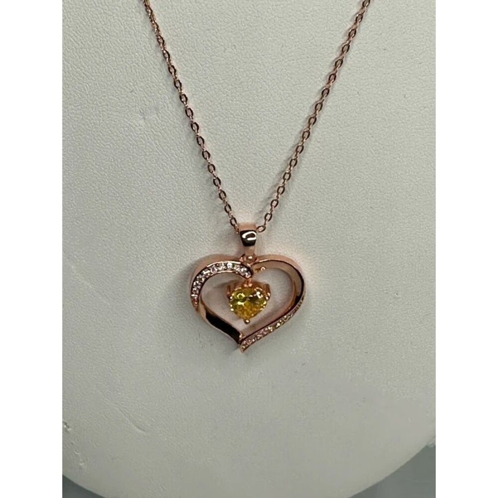 Heart pendant with yellow stone on chain New